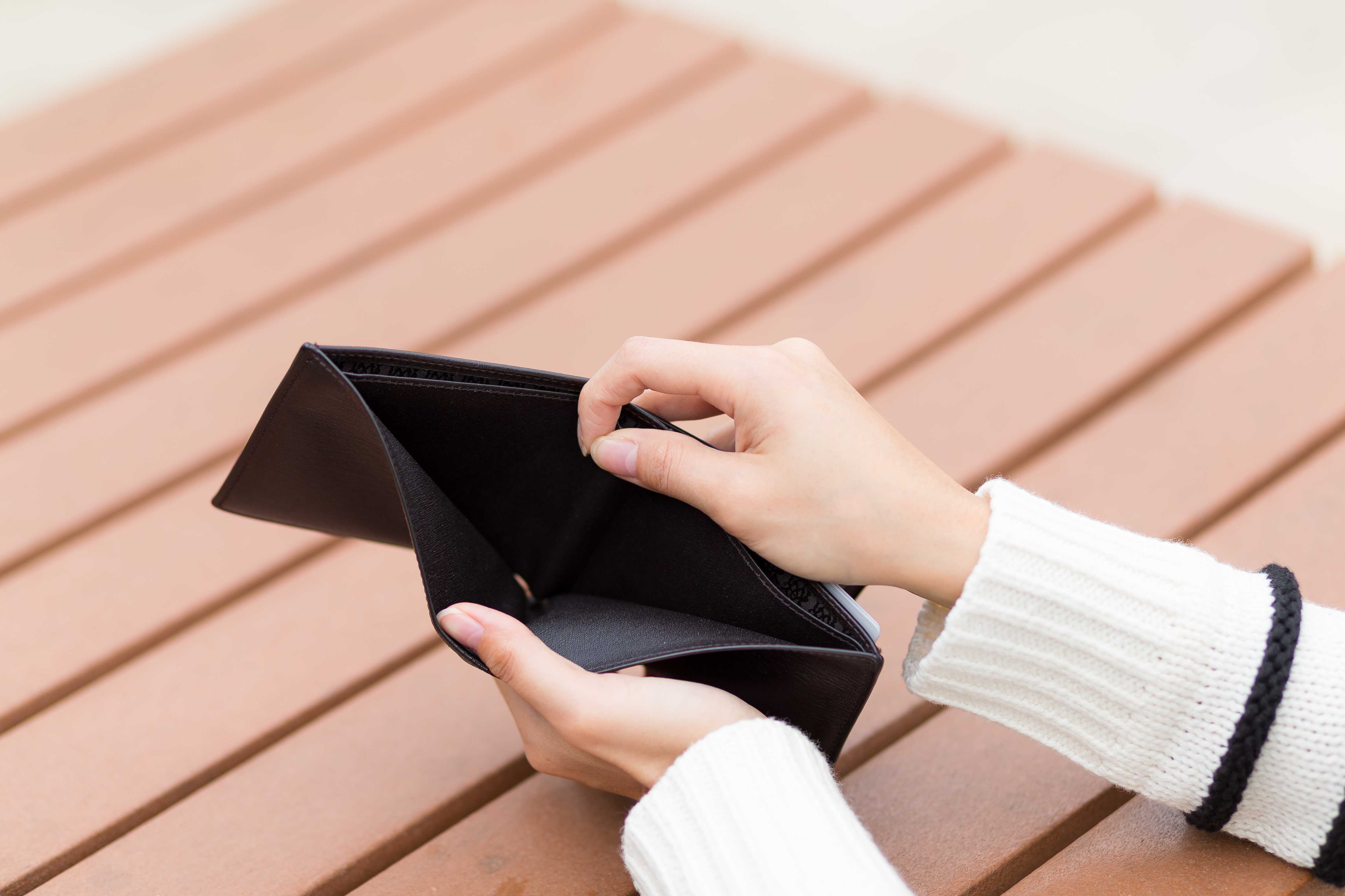 Woman Holding An Empty Wallet 2025 03 25 08 55 54 Utc