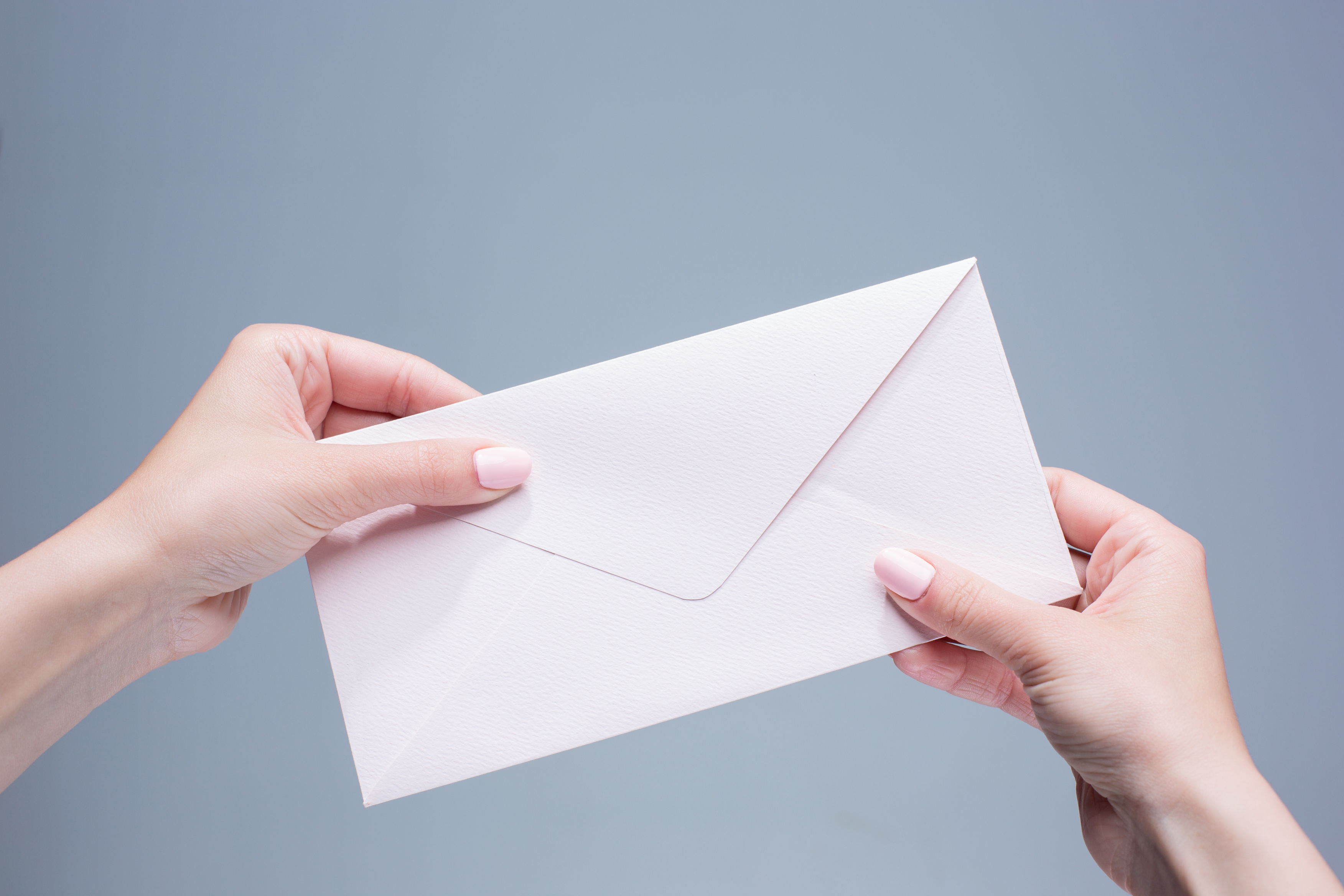 The Female Hands With Envelope Against The Gray Ba 2024 10 18 03 22 37 Utc